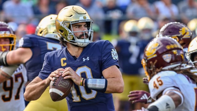 Notre Dame Fighting Irish quarterback Sam Hartman throws the ball against the Central Michigan Chippewas.